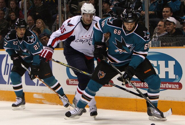 SAN JOSE, CA - DECEMBER 30:  Frazer McLaren #68 of the San Jose Sharks is defended by Jeff Schultz #55 of the Washington Capitals during an NHL game at the HP Pavilion on December 30, 2009 in San Jose, California.  (Photo by Jed Jacobsohn/Getty Images)