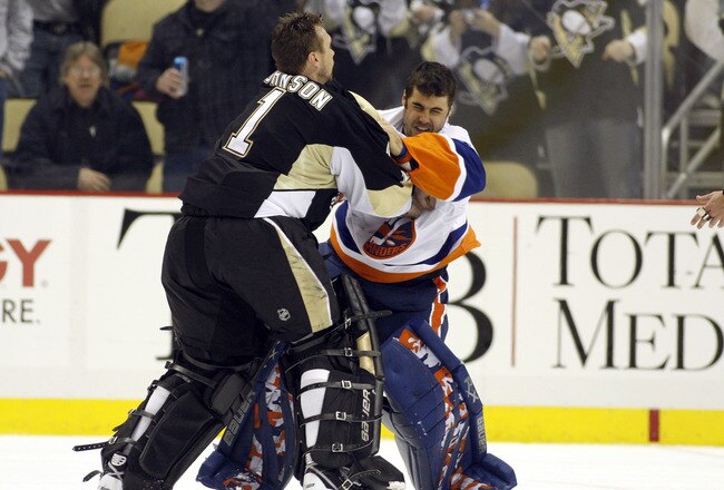 PITTSBURGH, PA - FEBRUARY 02:  Brent Johnson #1 of the Pittsburgh Penguins gets in a left against Rick DiPietro #39 of the New York Islanders at Consol Energy Center on February 2, 2011 in Pittsburgh, Pennsylvania.  The Penguins shut out the Islanders 3-0.  (Photo by Justin K. Aller/Getty Images)