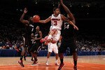 NEW YORK - MARCH 10: Peyton Siva #3 of the Louisville Cardinals looks to pass against Yancy Gates #34 of the Cincinnati Bearcats during the second round of 2010 NCAA Big East Tournament at Madison Square Garden on March 10, 2010 in New York City.  (Photo by Jim McIsaac/Getty Images)