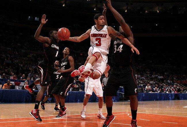 NEW YORK - MARCH 10: Peyton Siva #3 of the Louisville Cardinals looks to pass against Yancy Gates #34 of the Cincinnati Bearcats during the second round of 2010 NCAA Big East Tournament at Madison Square Garden on March 10, 2010 in New York City.  (Photo by Jim McIsaac/Getty Images)