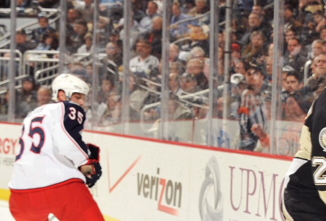 PITTSBURGH, PA - FEBRUARY 8:  Matt Cooke #24 of the Pittsburgh Penguins checks Fedor Tyutin #51 of the Columbus Blue Jackets in the first period on February 8, 2011 at CONSOL Energy Center in Pittsburgh, Pennsylvania. Cooke was assessed a five-minute major penalty for charging on the play.  (Photo by Jamie Sabau/Getty Images)