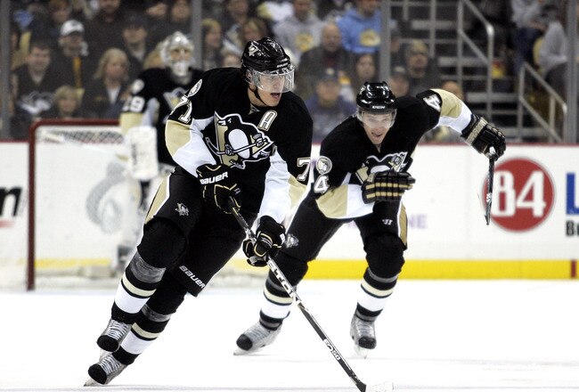 PITTSBURGH, PA - JANUARY 10:  Evgeni Malkin #71 of the Pittsburgh Penguins carries the puck up ice against the Boston Bruins on January 10, 2011 at Consol Energy Center in Pittsburgh, Pennsylvania.  (Photo by Justin K. Aller/Getty Images)