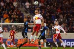 HARRISON, NJ - NOVEMBER 04:  Rafael Marquez #4 of the New York Red Bulls heads the ball against Ryan Johnson #19 of the San Jose Earthquakes during the 2nd Leg of the MLS playoffs on November 4, 2010 at Red Bull Arena in Harrison, New Jersey.  The Earthquakes defeat the Red Bulls 3-1.  (Photo by Mike Stobe/Getty Images for New York Red Bulls)