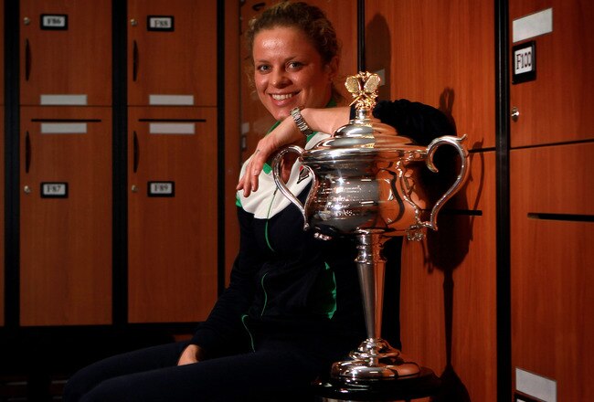 MELBOURNE, AUSTRALIA - JANUARY 29:  Kim Clijsters of Belgium poses with the Daphne Akhurst Trophy in the changing room after winning her women's final match against Na Li of China during day thirteen of the 2011 Australian Open at Melbourne Park  on January 29, 2011 in Melbourne, Australia.  (Photo by Fiona Hamilton/Pool/Getty Images)