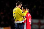 LONDON, ENGLAND - MARCH 31:  Former team mates Gerard Pique (L) of Barcelona and Cesc Fabregas of Arsenal hug each other following their teams' 2-2 draw in the UEFA Champions League quarter final first leg match between Arsenal and FC Barcelona at the Emirates Stadium on March 31, 2010 in London, England.  (Photo by Shaun Botterill/Getty Images)