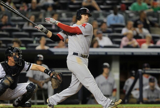 NEW YORK - SEPTEMBER 25: Ryan Kalish #55 of the Boston Red Sox hits a double to get team mate Yamaico Navarro #56 home against the New York Yankees during their game on September 25, 2010 at Yankee Stadium in the Bronx borough of New York City.  (Photo by Chris McGrath/Getty Images)