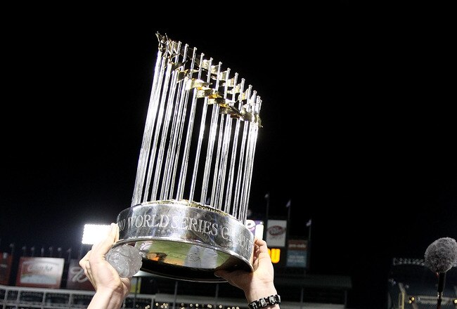 ARLINGTON, TX - NOVEMBER 01:  Tim Lincecum of the San Francisco Giants celebrates with the World Series Championship trophy after the Giants won 3-1 the Texas Rangers in Game Five of the 2010 MLB World Series at Rangers Ballpark in Arlington on November 1, 2010 in Arlington, Texas.  (Photo by Ronald Martinez/Getty Images)