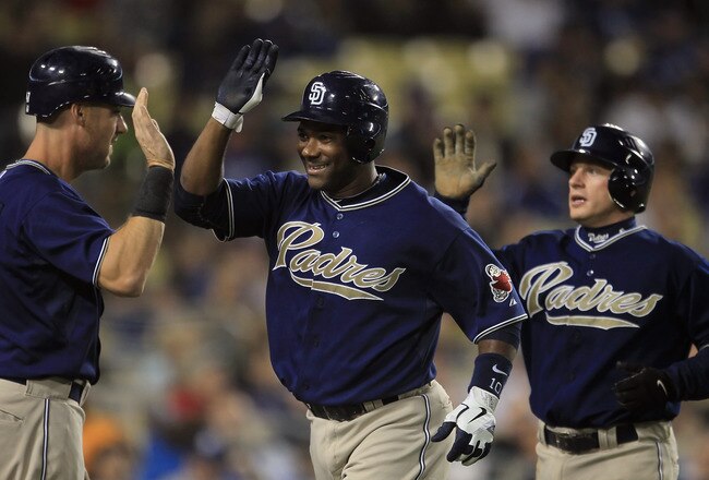 LOS ANGELES, CA - SEPTEMBER 22:  (L-R) Ryan Ludwick #47, Miguel Tejada #10 and David Eckstein #22 of the San Diego Padres celebrate Tejada's two-run home run in the third inning against the Los Angeles Dodgers at Dodger Stadium on September 22, 2010 in Los Angeles, California.  (Photo by Jeff Gross/Getty Images)