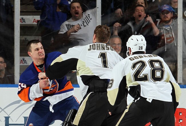 UNIONDALE, NY - FEBRUARY 11:  Micheal Haley #59 of the New York Islanders fights Brent Johnson #1 of the Pittsburgh Penguins in the third period on February 11, 2011 at Nassau Coliseum in Uniondale, New York. The Isles defeated the Pens 9-3.  (Photo by Jim McIsaac/Getty Images)
