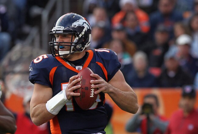 DENVER - DECEMBER 26:  Quarterback Tim Tebow #15 of the Denver Broncos rolls out and looks to deliver a pass against the Houston Texas at INVESCO Field at Mile High on December 26, 2010 in Denver, Colorado. The Broncos defeated the Texans 24-23.  (Photo by Doug Pensinger/Getty Images)