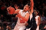 NEW YORK - NOVEMBER 18:  Jordan Williams #20 of the Maryland Terrapin drives past Gary McGhee #52 of the Pittsburgh Panthers during the 2k Sports Classic at Madison Square Garden on November 18, 2010 in New York, New York.  (Photo by Chris McGrath/Getty Images)