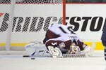 NASHVILLE, TN - FEBRUARY 12:  Goalie Peter Budaj #31 of the Colorado Avalanche lays on the ice as Steve Sullivan #26 of the Nashville Predators celebrates the go ahead goal on February 12, 2011 at the Bridgestone Arena in Nashville, Tennessee.  (Photo by Frederick Breedon/Getty Images)