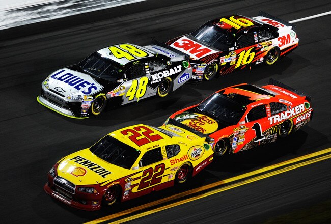 DAYTONA BEACH, FL - FEBRUARY 12:  Kurt Busch, driver of the #22 Shell/Pennzoil Dodge, Jimmie Johnson, driver of the #48 Lowe's Chevrolet, Jamie McMurray, driver of the #1 Bass Pro Shops Chevrolet, and Greg Biffle, driver of the #16 3M Ford, race during the NASCAR Budweiser Shootout at Daytona International Speedway on February 12, 2011 in Daytona Beach, Florida.  (Photo by John Harrelson/Getty Images for NASCAR)