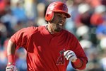 TEMPE, AZ - MARCH 15:  Maicer Izturis #13 of the Los Angeles Angels of Anaheim walks onto the field before a Spring Training game against the Los Angeles Dodgers on March 15, 2010 at Tempe Diablo Stadium in Tempe, Arizona.  (Photo by Lisa Blumenfeld/Getty Images)