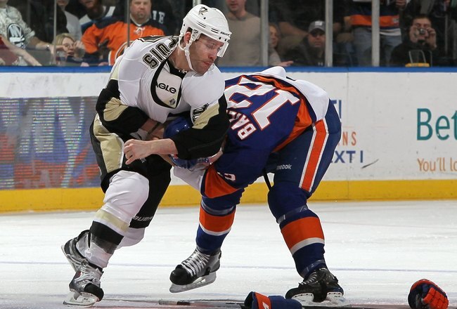 UNIONDALE, NY - FEBRUARY 11:  Josh Bailey #12 of the New York Islanders duels Pascal Dupuis #9 of the Pittsburgh Penguins during the second period on February 11, 2011 at Nassau Coliseum in Uniondale, New York.  (Photo by Jim McIsaac/Getty Images)
