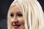 ARLINGTON, TX - FEBRUARY 06:  Singer Christina Aguilera looks on prior to singing the National Anthem during Super Bowl XLV between the Green Bay Packers and the Pittsburgh Steelers at Cowboys Stadium on February 6, 2011 in Arlington, Texas.  (Photo by Jamie Squire/Getty Images)