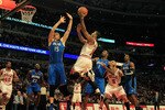 CHICAGO, IL - JANUARY 28: Derrick Rose #1 of the Chicago Bulls puts up a shot between Hedo Turkoglu #15 and Gilbert Arenas #1 of the Orlando Magic at the United Center on January 28, 2011 in Chicago, Illinois. The Bulls defeated the Magic 99-90. NOTE TO USER: User expressly acknowledges and agrees that, by downloading and/or using this photograph, User is consenting to the terms and conditions of the Getty Images License Agreement. (Photo by Jonathan Daniel/Getty Images)