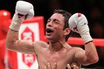 TOKYO - APRIL 30:  Fernando Montiel of Mexico celebrates after knocking out Hozumi Hasegawa of Japan during the WBC Bantamweight Title Fight between Hozumi Hasegawa and Fernando Montiel at Nippon Budokan on April 30, 2010 in Tokyo, Japan.  (Photo by Koichi Kamoshida/Getty Images)