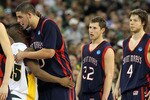 HOUSTON - MARCH 26:  Guard Tweety Carter #45 of the Baylor Bears hugs Omar Samhan #50 of the St. Mary's Gaels after a 72-49 win during the south regional semifinal of the 2010 NCAA men's basketball tournament at Reliant Stadium on March 26, 2010 in Houston, Texas.  (Photo by Ronald Martinez/Getty Images)