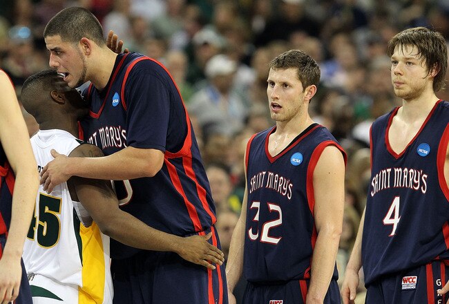 HOUSTON - MARCH 26:  Guard Tweety Carter #45 of the Baylor Bears hugs Omar Samhan #50 of the St. Mary's Gaels after a 72-49 win during the south regional semifinal of the 2010 NCAA men's basketball tournament at Reliant Stadium on March 26, 2010 in Houston, Texas.  (Photo by Ronald Martinez/Getty Images)
