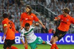 ISTANBUL, TURKEY - MAY 20:  Olexandr Kucher of Shakhtar Donetsk tangles with Mesut Oezil of Werder Bremen during the UEFA Cup Final between Shakhtar Donetsk and Werder Bremen at the Sukru Saracoglu Stadium on May 20, 2009 in Istanbul, Turkey.  (Photo by Michael Steele/Getty Images)