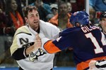 UNIONDALE, NY - FEBRUARY 11:  Trevor Gillies #14 of the New York Islanders fights Eric Godard #28 of the Pittsburgh Penguins on February 11, 2011 at Nassau Coliseum in Uniondale, New York. The Isles defeated the Pens 9-3.  (Photo by Jim McIsaac/Getty Images)