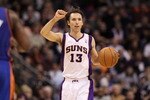 PHOENIX, AZ - JANUARY 07:  Steve Nash #13 of the Phoenix Suns handles the ball during the NBA game against the New York Knicks at US Airways Center on January 7, 2011 in Phoenix, Arizona.  The Knicks defeated the Suns 121-96.  NOTE TO USER: User expressly acknowledges and agrees that, by downloading and or using this photograph, User is consenting to the terms and conditions of the Getty Images License Agreement.  (Photo by Christian Petersen/Getty Images)