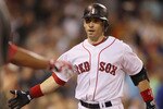 BOSTON - SEPTEMBER 08:  Marco Scutaro #16 of the Boston Red Sox is congratulated after he hit a two run homer against the Tampa Bay Rays on September 8, 2010 at Fenway Park in Boston, Massachusetts.  (Photo by Elsa/Getty Images)