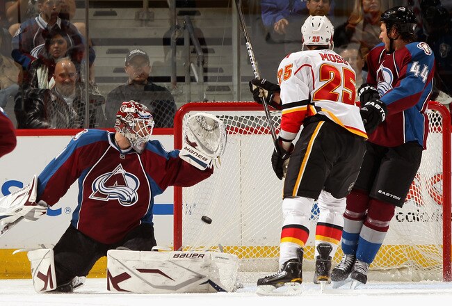 DENVER, CO - FEBRUARY 14:  Goalie Peter Budaj #31 of the Colorado Avalanche looks over his shoulder as a shot by Anton Babchuk of the Calgary Flames goes into the goal as David Moss #25 of the Flames and Ryan Wilson #44 of the Avalanche watch during the first period at the Pepsi Center on February 14, 2011 in Denver, Colorado. Budaj was pulled after the goal which was the second goal given up in the first six minutes of the game.  (Photo by Doug Pensinger/Getty Images)