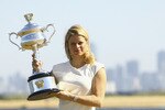 MELBOURNE, AUSTRALIA - JANUARY 30:  Kim Clijsters of Belgium poses with the Daphne Akhurst Trophy after winning the 2011 Women's Australian Open final, at Brighton Beach on January 30, 2011 in Melbourne, Australia.  (Photo by Robert Prezioso/Getty Images)