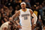 DENVER, CO - JANUARY 21:  Carmelo Anthony #15 of the Denver Nuggets looks on during a break in the action against the Los Angeles Lakers at the Pepsi Center on January 21, 2011 in Denver, Colorado. The Lakers defeated the Nuggets 107-97. NOTE TO USER: User expressly acknowledges and agrees that, by downloading and or using this photograph, User is consenting to the terms and conditions of the Getty Images License Agreement.  (Photo by Doug Pensinger/Getty Images)