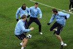 MILAN, ITALY - FEBRUARY 14:  (L-R) Michael Dawson, William Gallas, Rafael van der Vaart and Peter Crouch in action during a training session on the day before the UEFA Champions League Round of 16, 1st leg match between AC Milan and Tottenham Hotspur at the San Siro Stadium on February 14, 2011 in Milan, Italy. (Photo by Alex Livesey/Getty Images)