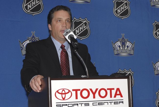 EL SEGUNDO, CA - JULY 5:  President and General Manager Dean Lombardi (L) of the Los Angeles Kings welcomes back veteran defenseman Rob Blake (R) after Blake agreed to a two-year contract with the team on July 5, 2006 at the Toyota Sports Center in El Segundo, California. Blake was drafted by the Kings in 1988 and played with the team until 2001 when he was traded to the Colorado Avalanche.  (Photo by Andrew D. Bernstein/Getty Images)