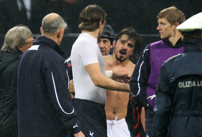 MILAN, ITALY - FEBRUARY 15:  Tottenham Hotspur First Team Coach Joe Jordan and Gennaro Gattuso of AC Milan clash at the end of the UEFA Champions League round of 16 first leg match between AC Milan and Tottenham Hotspur at Stadio Giuseppe Meazza on February 15, 2011 in Milan, Italy.  (Photo by Alex Livesey/Getty Images)