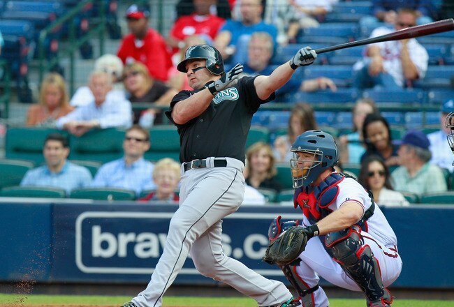 ATLANTA - SEPTEMBER 29:  Dan Uggla #6 of the Florida Marlins against David Ross #8 of the Atlanta Braves at Turner Field on September 29, 2010 in Atlanta, Georgia.  (Photo by Kevin C. Cox/Getty Images)