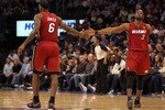 OKLAHOMA CITY, OK - JANUARY 30:  Forward LeBron James #6 and Dwyane Wade #3 of the Miami Heat slap hands during play against the Oklahoma City Thunder at Ford Center on January 30, 2011 in Oklahoma City, Oklahoma.  NOTE TO USER: User expressly acknowledges and agrees that, by downloading and or using this photograph, User is consenting to the terms and conditions of the Getty Images License Agreement.  (Photo by Ronald Martinez/Getty Images)