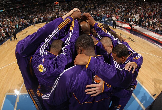 DENVER - NOVEMBER 11:  The Los Angeles Lakers huddle up as they prepare to face the Denver Nuggets at Pepsi Center on November 11, 2010 in Denver, Colorado. NOTE TO USER: User expressly acknowledges and agrees that, by downloading and/or using this Photograph, User is consenting to the terms and conditions of the Getty Images License Agreement.  (Photo by Doug Pensinger/Getty Images)
