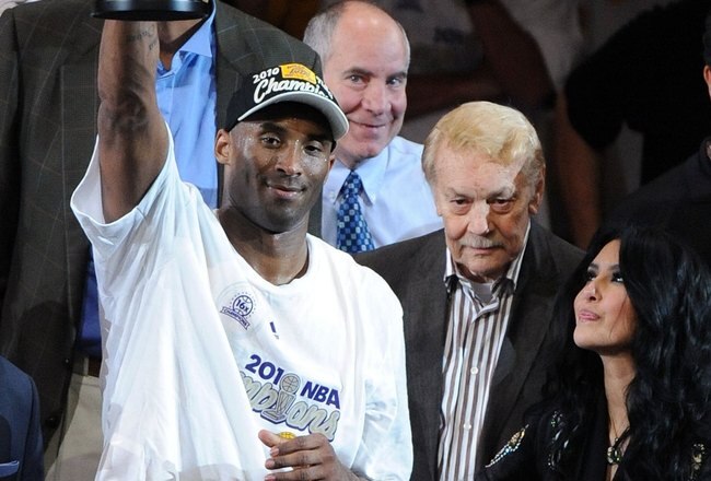 LOS ANGELES, CA - JUNE 17:  Kobe Bryant #24 of the Los Angeles Lakers holds up the Bill Russell Finals MVP trophy alongside team owner Dr. Jerry Buss and Bryant's wife Vanessa after the Lakers defeated the Boston Celtics 83-79 in Game Seven of the 2010 NBA Finals at Staples Center on June 17, 2010 in Los Angeles, California.  NOTE TO USER: User expressly acknowledges and agrees that, by downloading and/or using this Photograph, user is consenting to the terms and conditions of the Getty Images License Agreement.  (Photo by Lisa Blumenfeld/Getty Images)