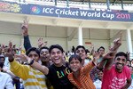 NAGPUR, INDIA - FEBRUARY 15:  Spectators pose for a picture at the Zimbabwe v Ireland - 2011 ICC World Cup Warm Up Game on February 15, 2011 in Nagpur, India.  (Photo by Ritam Banerjee/Getty Images)
