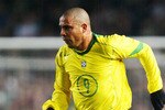 DUBLIN - FEBRUARY 18:  Ronaldo of Brazil runs with the ball during the International Friendly match between Republic of Ireland and Brazil held on February 18, 2004 at Lansdowne Road, in Dublin, Ireland. The match ended in a 0-0 draw. (Photo by Laurence Griffiths/Getty Images)