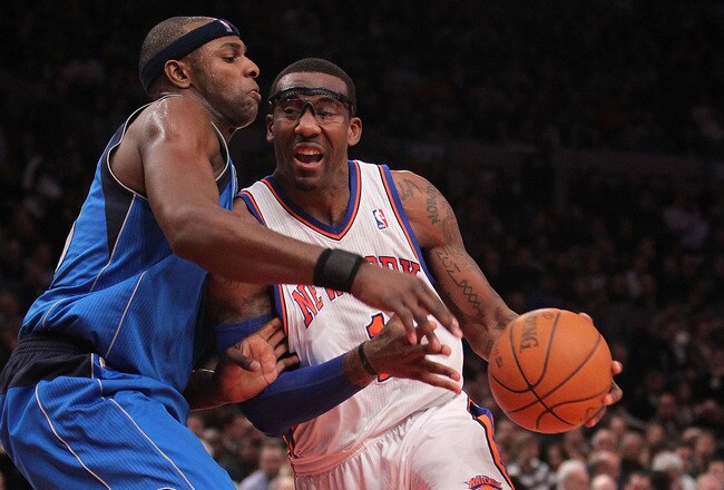 NEW YORK, NY - FEBRUARY 02:  Amar'e Stoudemire #1 of the New York Knicks drives to the basket against Brendan Haywood #33 of the Dallas Mavericks at Madison Square Garden on February 2, 2011 in New York City. NOTE TO USER: User expressly acknowledges and agrees that, by downloading and/or using this Photograph, User is consenting to the terms and conditions of the Getty Images License Agreement.  (Photo by Nick Laham/Getty Images)