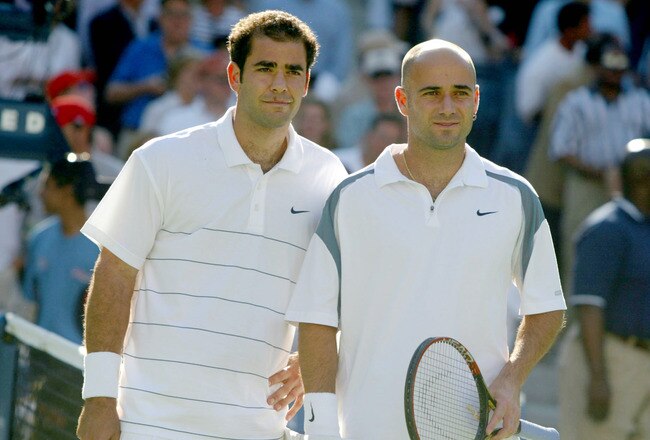 FLUSHING, NY - SEPTEMBER 8: Pete Sampras and Andre Agassi psoe at the net before their match during the finals of the US Open September 8, 2002 at the USTA National Tennis Center in Flushing Meadows Corona Park in Flushing, New York.  (Photo by Al Bello/Getty Images)