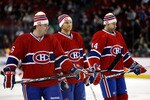 MONTREAL, CANADA - JANUARY 17:  (L-R) Jaroslav Spacek #6, Jeff Halpern #15 and Roman Hamrlik #44 of the Montreal Canadiens warm up in their Heritage Classic Tuques prior to facing the Calgary Flames in their NHL game at the Bell Centre on January 17, 2011 in Montreal, Quebec, Canada.  (Photo by Richard Wolowicz/Getty Images)