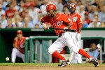 WASHINGTON - JULY 01:  Nyjer Morgan #1 of the Washington Nationals bunts for a single in the ninth inning against the New York Mets at Nationals Park on July 1, 2010 in Washington, DC. The Nationals won the game 2-1.  (Photo by Greg Fiume/Getty Images)