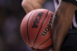 SAN JOSE, CA - MARCH 20:  An official holds the ball during the game between the Butler Bulldogs and the Murray State Racers in the second round of the 2010 NCAA men's basketball tournament at HP Pavilion on March 20, 2010 in San Jose, California.  (Photo by Jed Jacobsohn/Getty Images)