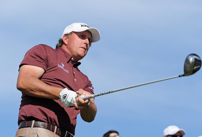 PEBBLE BEACH, CA - FEBRUARY 13:  Phil Mickelson plays his tee shot on the nineth hole during the final round of the AT&T Pebble Beach National Pro-Am at Pebble Beach Golf Links on February 13, 2011  in Pebble Beach, California.  (Photo by Stuart Franklin/Getty Images)