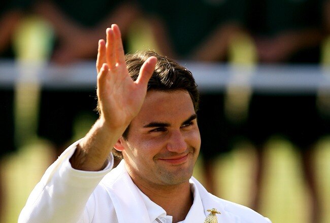 LONDON - JULY 08: Roger Federer of Switzerland waves to the crowd as he celebrates victory, following the Men's Singles final match against Rafael Nadal of Spain during day thirteen of the Wimbledon Lawn Tennis Championships at the All England Lawn Tennis and Croquet Club on July 8, 2007 in London, England. Roger Federer claims his fifth consecutive championship title. (Photo by Ryan Pierse/Getty Images)