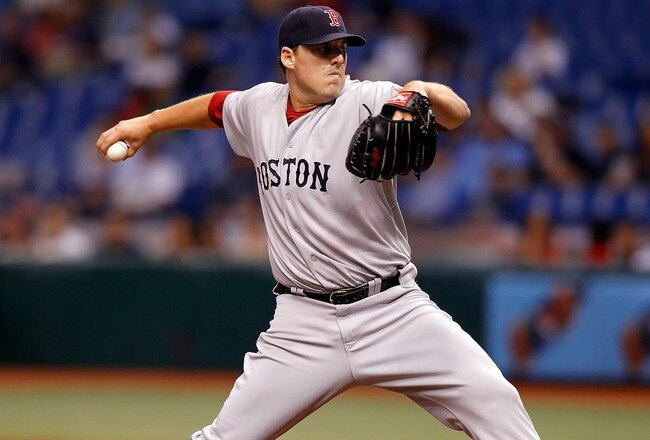 ST. PETERSBURG - AUGUST 29:  Pitcher John Lackey #40 of the Boston Red Sox pitches against the Tampa Bay Rays during the game at Tropicana Field on August 29, 2010 in St. Petersburg, Florida.  (Photo by J. Meric/Getty Images)