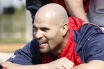 JUPITER, FL - FEBRUARY 17: Albert Pujols #5 of the St. Louis Cardinals stretches prior to batting practice at Roger Dean Stadium on February 17, 2011 in Jupiter, Florida. (Photo by Joel Auerbach/Getty Images)