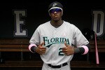 DENVER - MAY 10:  Cameron Maybin #24 of the Florida Marlins shows off his pink accessories in support of the 'Going To Bat Against Breast Cancer' promotion prior to facing the Colorado Rockies during MLB action at Coors Field on May 10, 2009 in Denver, Colorado.  (Photo by Doug Pensinger/Getty Images)